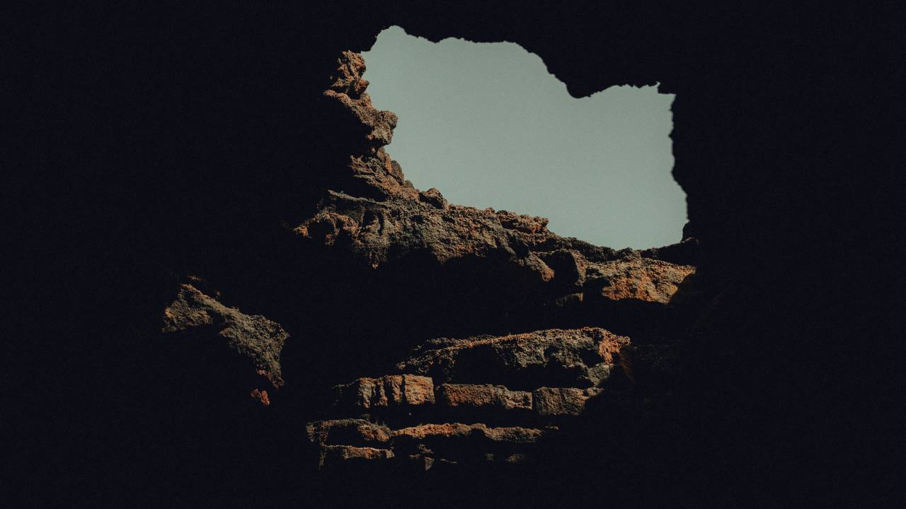 A large opening at the end of an underground tunnel
